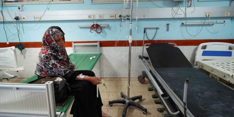 U.S. doctor who refused to leave Gaza says he ‘cannot abandon my team’