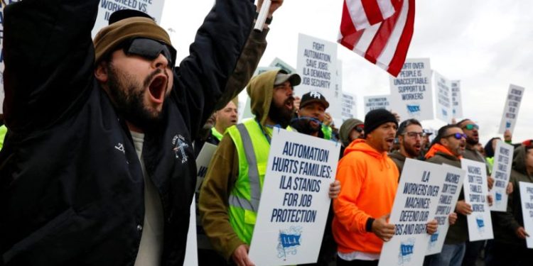 Dockworkers on East and Gulf Coast to return to work after reaching agreement on wages