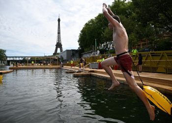 Joyful Parisians take a historic plunge into the Seine after 100 years